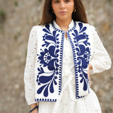 White vest with floral embroidery